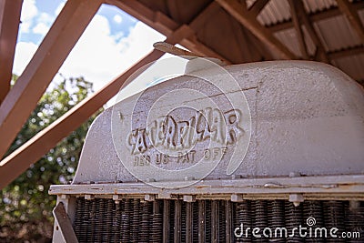 Up close photo of Caterpillar logo on an engine of an old tractor Editorial Stock Photo