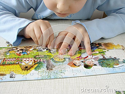 Puzzle assembling Stock Photo