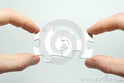 Puzzle in hands Stock Photo