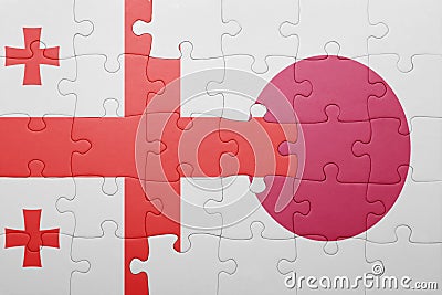 Puzzle with the national flag of georgia and japan Stock Photo