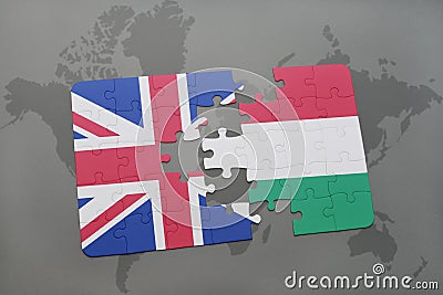 puzzle with the national flag of great britain and hungary on a world map background Stock Photo