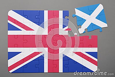 Puzzle with national flag of great britain and scotland piece detached. Stock Photo