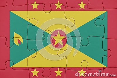 Puzzle with the national flag of grenada Stock Photo