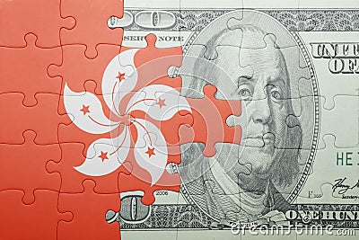 Puzzle with the national flag of hong kong and dollar banknote Stock Photo