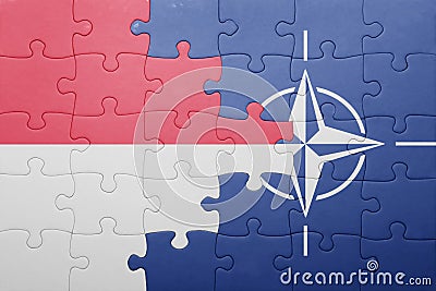 Puzzle with the national flag of indonesia and nato Editorial Stock Photo