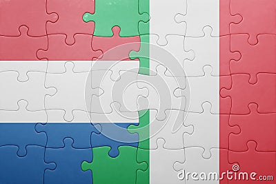 Puzzle with the national flag of italy and netherlands Stock Photo