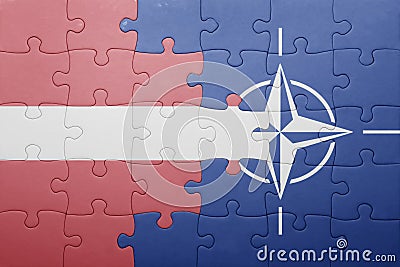 Puzzle with the national flag of latvia and nato Editorial Stock Photo