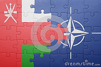 Puzzle with the national flag of oman and nato Editorial Stock Photo