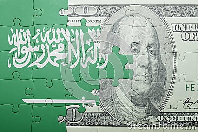 Puzzle with the national flag of saudi arabia and dollar banknote Stock Photo