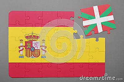 Puzzle with national flag of Spain and Basque Country piece detached. Stock Photo