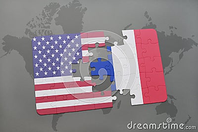 Puzzle with the national flag of united states of america and france on a world map background Stock Photo