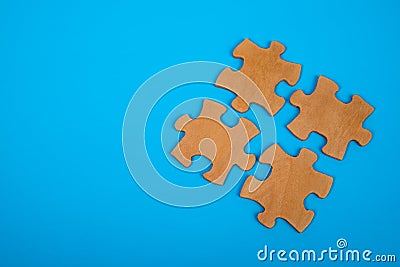 The puzzle pieces are merged into a single unit. on a blue background. Concept business idea, solution, teamwork Stock Photo