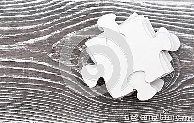 Puzzle pieces on wooden Stock Photo
