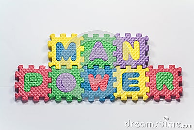 Puzzle pieces with word manpower Stock Photo