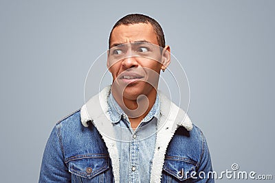 Puzzled expressive guy looking Stock Photo