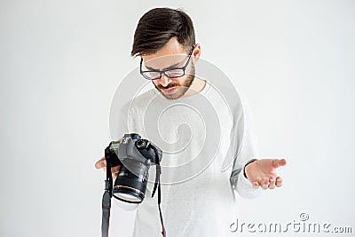 Puzzled photographer with camera Stock Photo