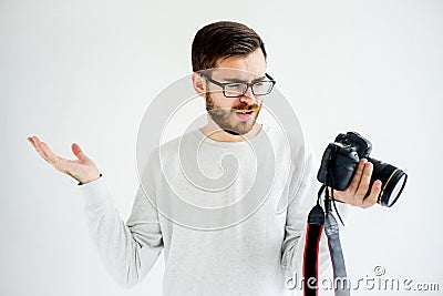 Puzzled photographer with camera Stock Photo