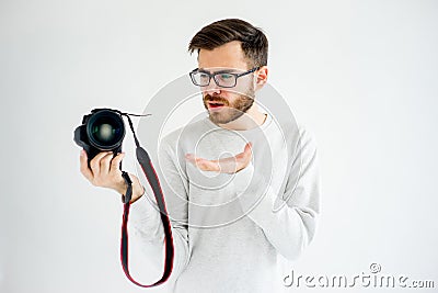 Puzzled photographer with camera Stock Photo