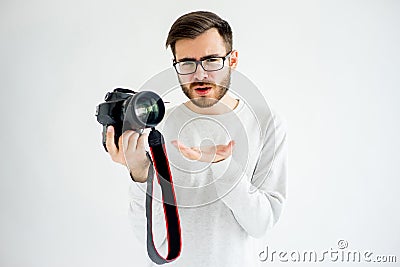 Puzzled photographer with camera Stock Photo