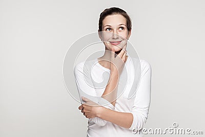 Puzzlement young adult beautiful woman embrace himself Stock Photo