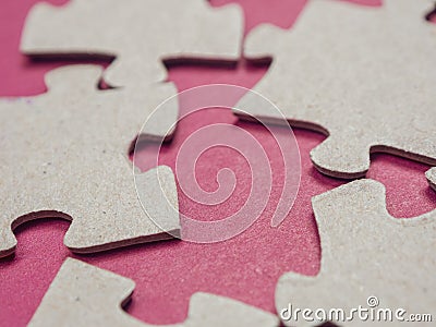 Puzzles create a unique background, symbolizing unity and harmony, revealing deep semantic connections and emotions Stock Photo