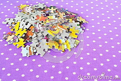 Puzzles on a lilac background. Baby puzzles game. Puzzles set Stock Photo