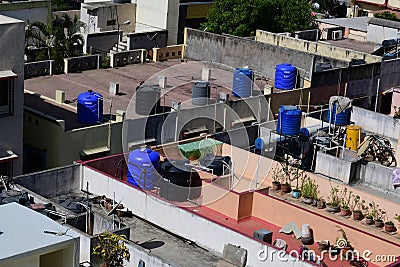 PVC water storage tanks installed on row house terraces Editorial Stock Photo