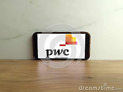 PwC logo displayed on mobile phone Editorial Stock Photo