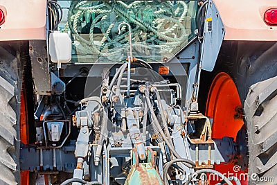 Hydraulic and pneumatic lines and connectors on rear of tractor Editorial Stock Photo