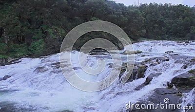 Pykara waterfalls surrounded by green forest Stock Photo