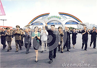 Official photo of the young North Korean Supreme Leader Kim Jong-un between comrades Editorial Stock Photo