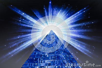 Pyramid and the bright flash of a star in space Stock Photo