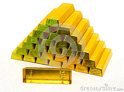 Pyramid from gold bullions Stock Photo