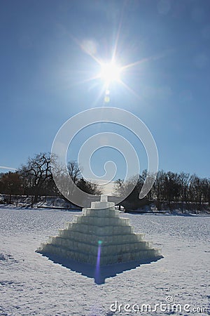 Pyramid made of Ice on a Frozen Lake in Sunshine Editorial Stock Photo