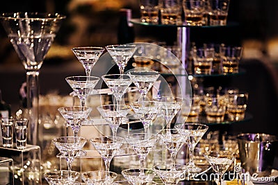 Pyramid of martinis glasses on a cocktail reception on wedding party Stock Photo