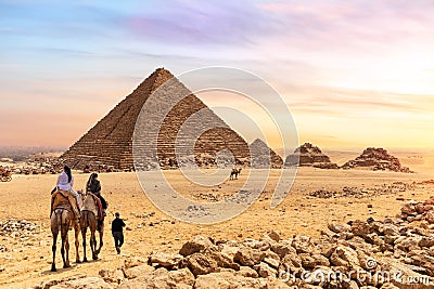 The Pyramid of Menkaure and tourists on camels, Giza, Egypt Editorial Stock Photo