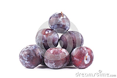 Pyramid pile of purple ripe plums on white background isolated close up macro Stock Photo