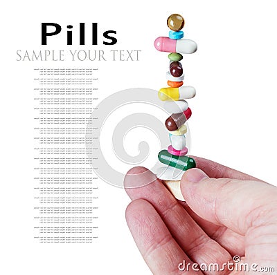 Pyramid of pills and tablets in hand isolated Stock Photo