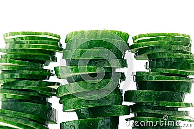 Pyramid from slices of cucumber. Frame with copy space. Concept art. Pattern. Stock Photo
