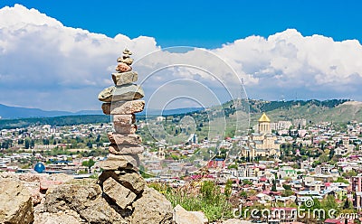 Pyramid of stones and panoramic view of Tbilisi city. Georgia Stock Photo
