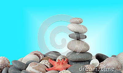 The pyramid of stones with sea shells Stock Photo