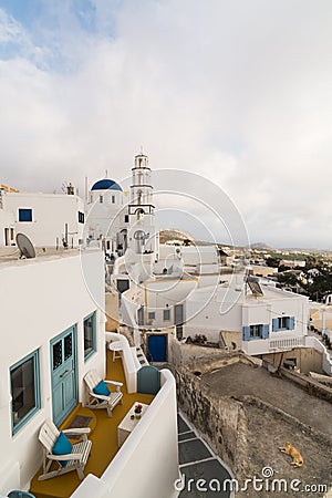 PYRGOS, GREECE - MAY 2018: View of orthodox church and bell tower in Pyrgos town center, Santorini island, Greece Editorial Stock Photo