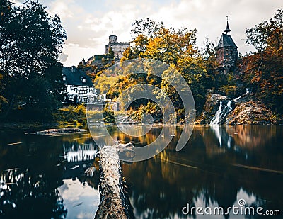 Elzbach stream with waterfall on old mill. next castle to pyrmont (Rhineland-Palatinate, Germanycastle Stock Photo