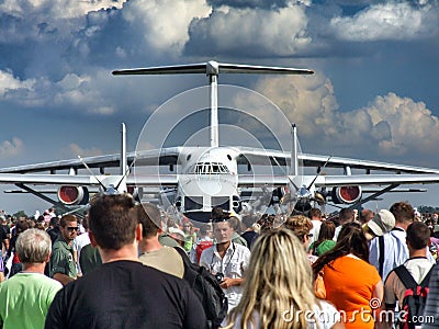 PZL M28 Skytruck and IL-76MD behind the visitors of Radom Air show. Editorial Stock Photo