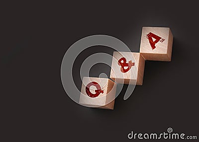 Q and A on wooden blocks Close-up Shot . Question and answers support center business concept Stock Photo