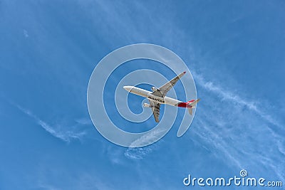QANTAS Airbus flying in deep blue sky Editorial Stock Photo