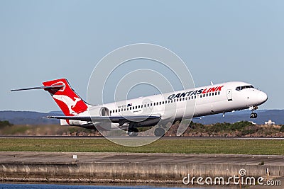 QantasLink Qantas Boeing 717 regional jet airliner taking off from Sydney Airport. Editorial Stock Photo