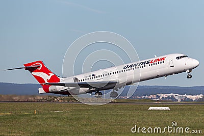 QantasLink Qantas Boeing 717 regional jet airliner taking off from Sydney Airport. Editorial Stock Photo
