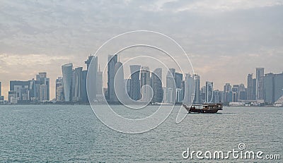 Qatar skyline along qatar traditional dhow in the foreground Stock Photo