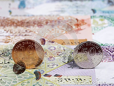 Qatari coins on the background of money Stock Photo
